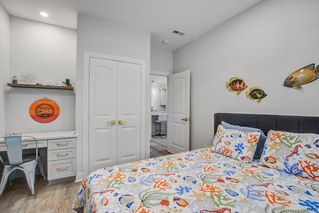 16 Oakwood Ln, Edisto Island, SC 29438 - bedroom with light wood-type flooring, a desk, a closet, and recessed lighting