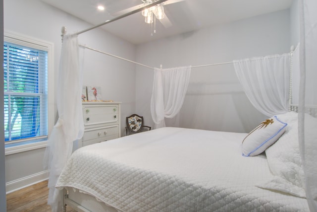 16 Oakwood Ln, Edisto Island, SC 29438 - bedroom with wood finished floors, multiple windows, and ceiling fan