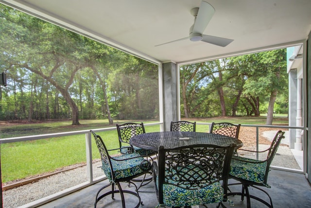 16 Oakwood Ln, Edisto Island, SC 29438 - sunroom / solarium with ceiling fan, outdoor dining space, and view of scattered trees