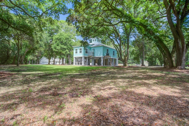 16 Oakwood Ln, Edisto Island, SC 29438 - view of grassy yard featuring a sunroom