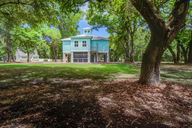 16 Oakwood Ln, Edisto Island, SC 29438 - back of house with a lawn