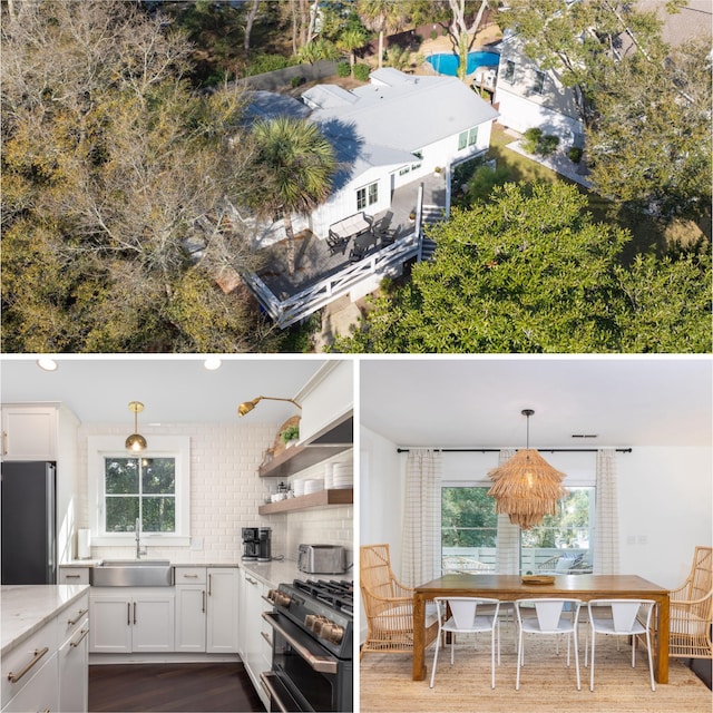 29 27th Ave, Isle Of Palms, SC 29451 - kitchen featuring freestanding refrigerator, a sink, range with two ovens, white cabinetry, and recessed lighting