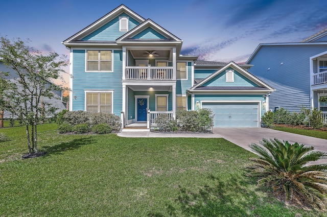 2336 Brinkley Rd, Johns Island, SC 29455 - view of front facade featuring a balcony, driveway, a front yard, covered porch, and an attached garage