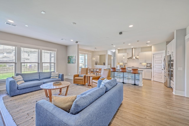 2336 Brinkley Rd, Johns Island, SC 29455 - living area with light wood-style floors, baseboards, and recessed lighting