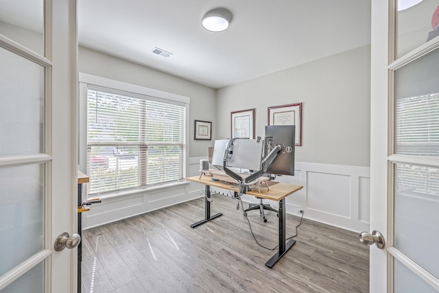 2336 Brinkley Rd, Johns Island, SC 29455 - office space with wood finished floors, wainscoting, and a decorative wall