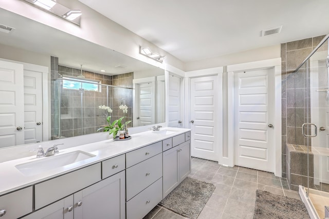 2336 Brinkley Rd, Johns Island, SC 29455 - bathroom featuring double vanity, a stall shower, and tile patterned floors