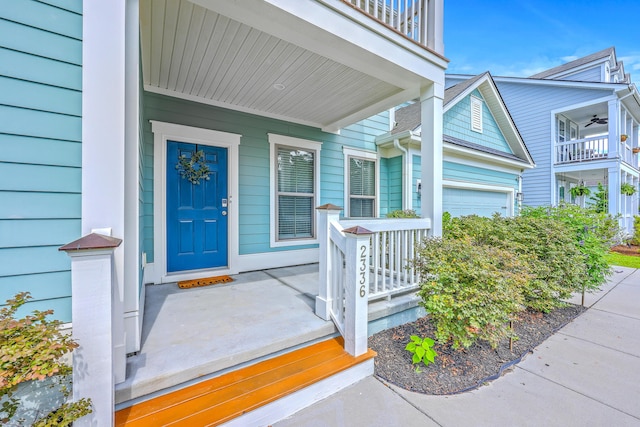 2336 Brinkley Rd, Johns Island, SC 29455 - property entrance with covered porch, a balcony, a ceiling fan, and an attached garage