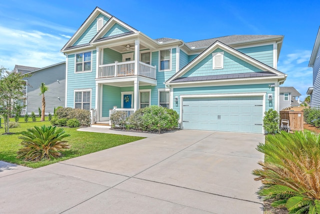 2336 Brinkley Rd, Johns Island, SC 29455 - view of front of property featuring a balcony, concrete driveway, covered porch, a front lawn, and ceiling fan