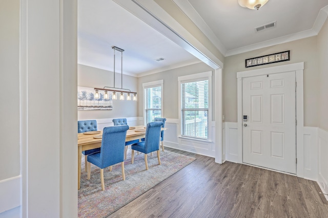 2336 Brinkley Rd, Johns Island, SC 29455 - entrance foyer featuring a wainscoted wall, crown molding, wood finished floors, and a decorative wall