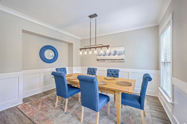 2336 Brinkley Rd, Johns Island, SC 29455 - dining room with wood finished floors, wainscoting, crown molding, and a decorative wall