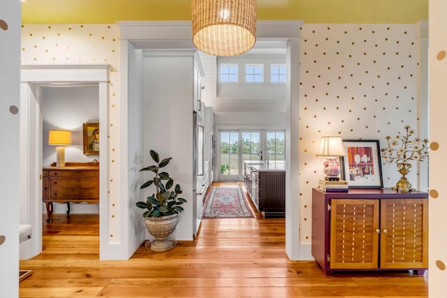 interior space featuring hardwood / wood-style floors and an inviting chandelier