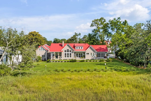 back of house with a yard