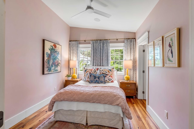 bedroom featuring lofted ceiling, light hardwood / wood-style floors, and ceiling fan