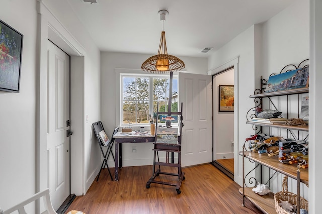 office with hardwood / wood-style flooring