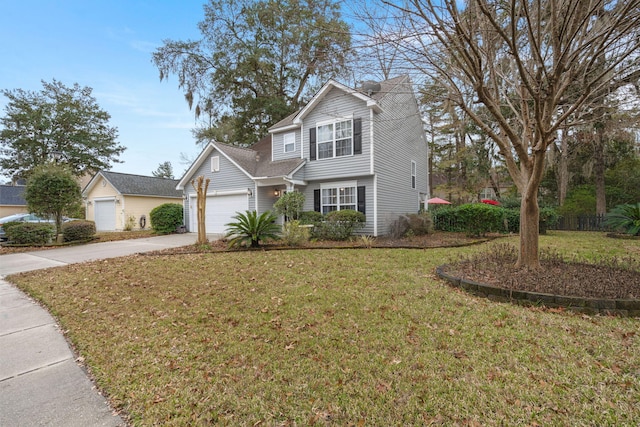 view of property featuring a garage and a front lawn