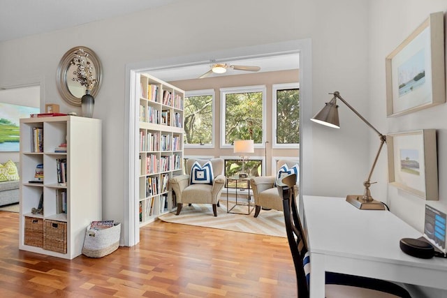 home office featuring hardwood / wood-style floors and ceiling fan