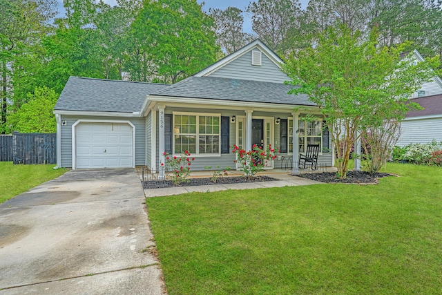 9156 Fieldstone Trce, Summerville, SC 29485 - view of front facade featuring a front yard, a shingled roof, covered porch, and a garage