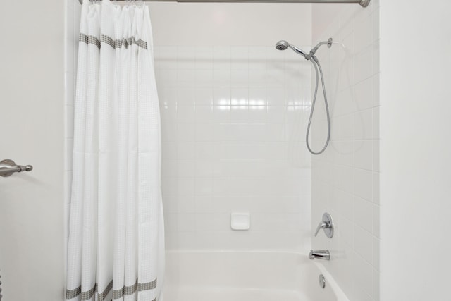 bathroom with shower / bath combination with curtain