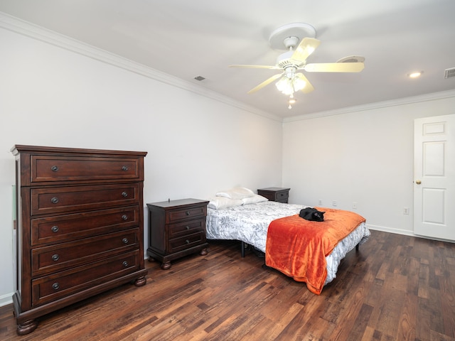 bedroom with ornamental molding, ceiling fan, and dark hardwood / wood-style flooring