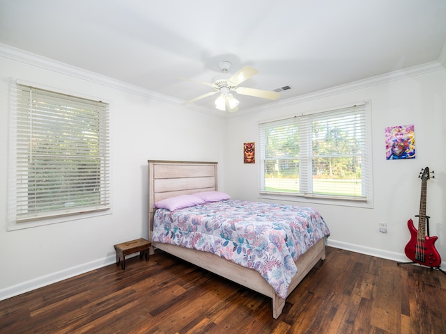 bedroom featuring crown molding, dark wood-type flooring, and ceiling fan