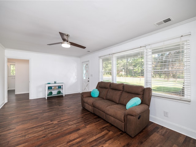 living room featuring ornamental molding, ceiling fan, and dark hardwood / wood-style floors