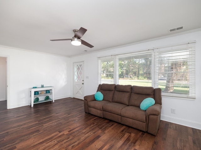 living room featuring dark hardwood / wood-style floors, ceiling fan, and plenty of natural light