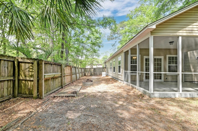 1453 Joy Ave, Charleston, SC 29407 - view of yard featuring a fenced backyard and a sunroom