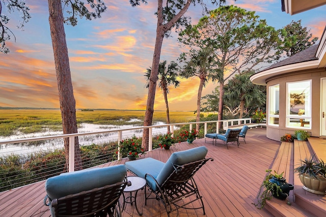 deck at dusk with a water view