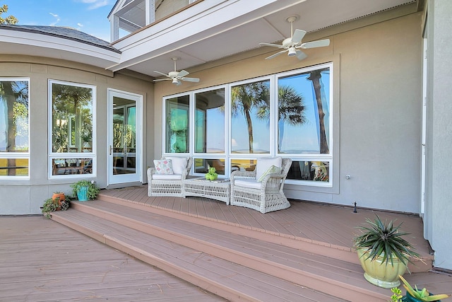 wooden deck with ceiling fan