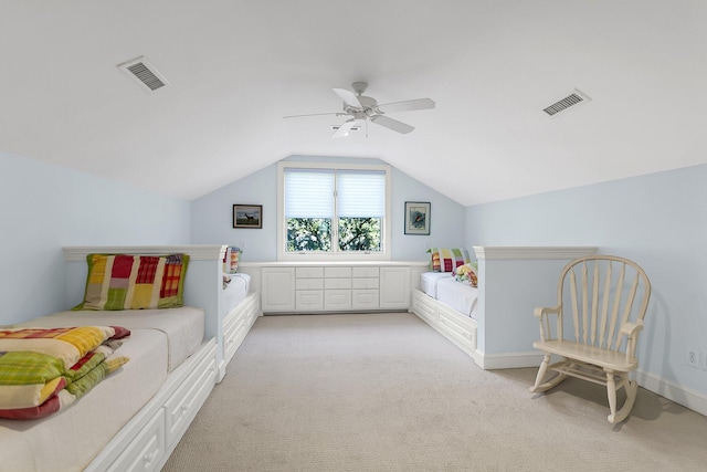 bedroom featuring vaulted ceiling, light carpet, and ceiling fan