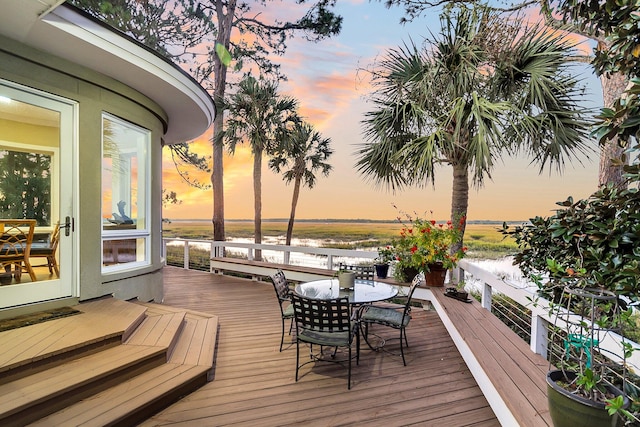 deck at dusk with a water view