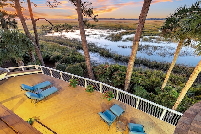 deck at dusk with a rural view