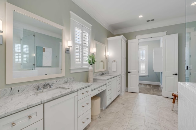 bathroom with marble finish floor, visible vents, crown molding, and a shower stall