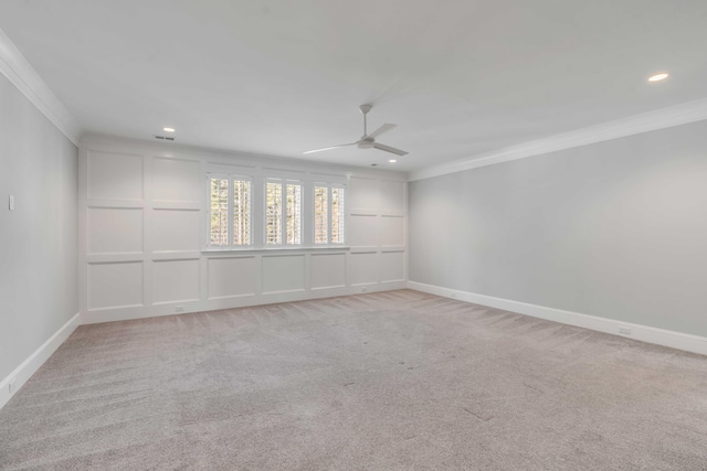 unfurnished room with light carpet, ceiling fan, ornamental molding, and baseboards