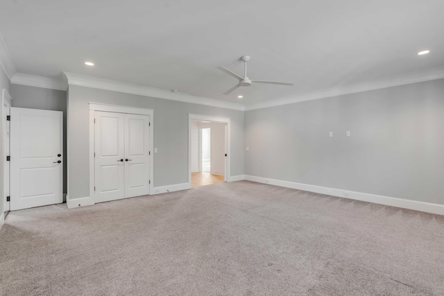 unfurnished bedroom with baseboards, ornamental molding, recessed lighting, and light colored carpet