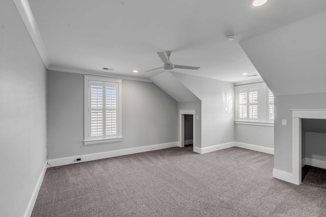 additional living space featuring recessed lighting, a ceiling fan, carpet flooring, vaulted ceiling, and baseboards