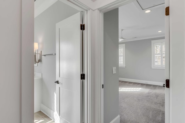 hall with carpet floors, recessed lighting, and baseboards