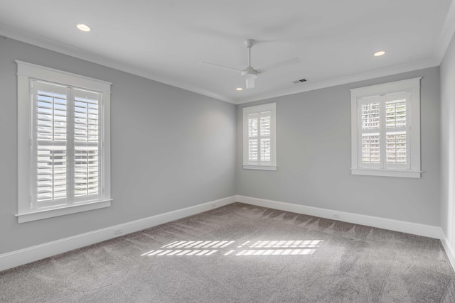 carpeted empty room featuring ceiling fan, baseboards, crown molding, and recessed lighting