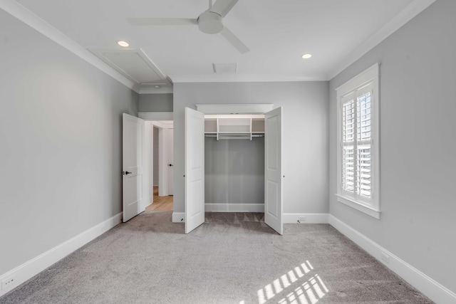 unfurnished bedroom with ornamental molding, carpet flooring, and baseboards