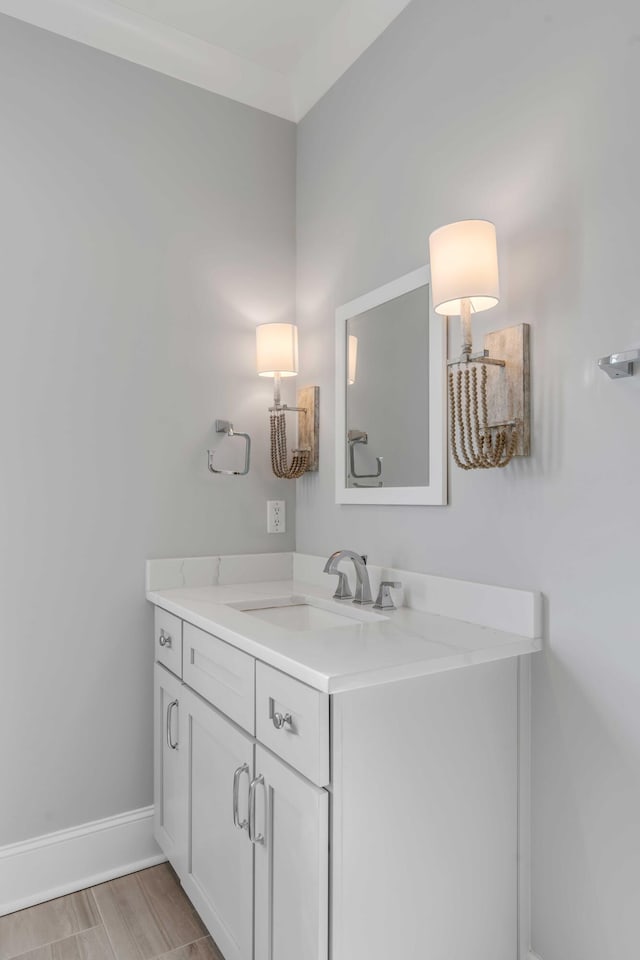 bathroom with vanity and baseboards