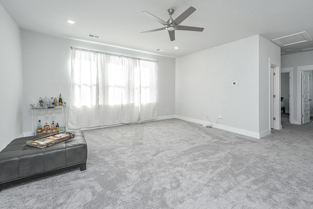 carpeted living room featuring ceiling fan