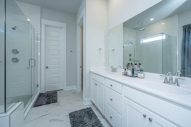 bathroom featuring walk in shower and vanity