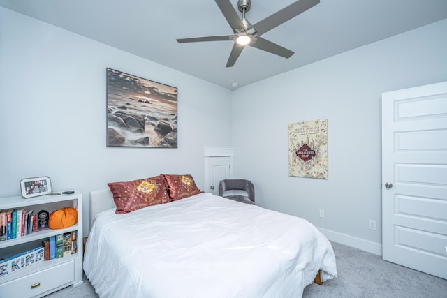 bedroom featuring ceiling fan and light colored carpet