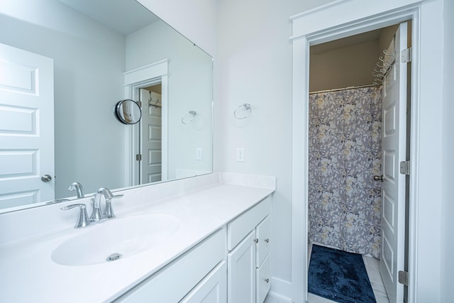 bathroom featuring vanity and a shower with shower curtain