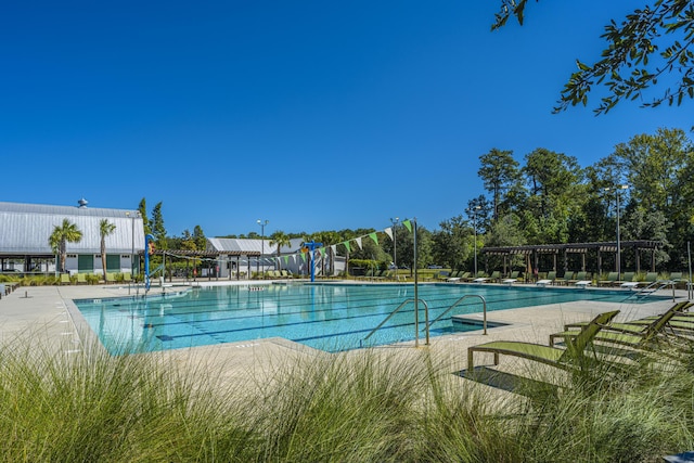 view of swimming pool featuring a pergola