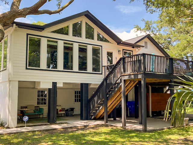 rear view of house with a patio area and a deck