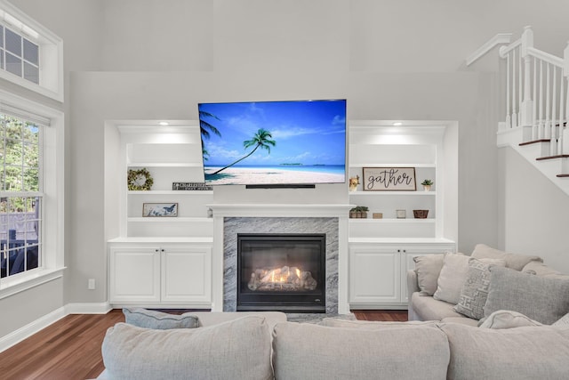2720 Oak Manor Dr, Mount Pleasant, SC 29466 - living area with dark wood-type flooring, stairway, baseboards, and built in features