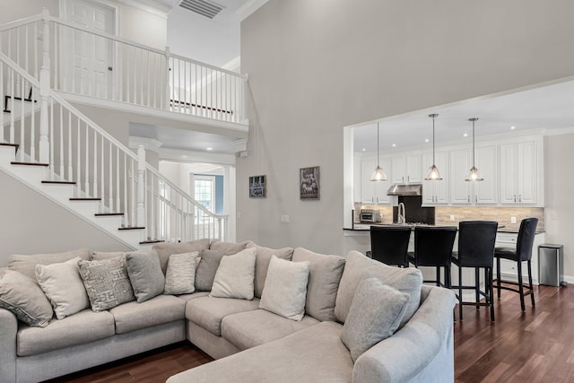 2720 Oak Manor Dr, Mount Pleasant, SC 29466 - living area featuring dark wood-style floors, stairway, ornamental molding, a towering ceiling, and recessed lighting