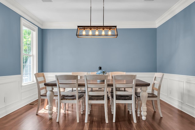 2720 Oak Manor Dr, Mount Pleasant, SC 29466 - dining area with ornamental molding, dark wood-style flooring, wainscoting, and a decorative wall