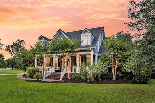 2720 Oak Manor Dr, Mount Pleasant, SC 29466 - new england style home with a porch, a lawn, and roof with shingles